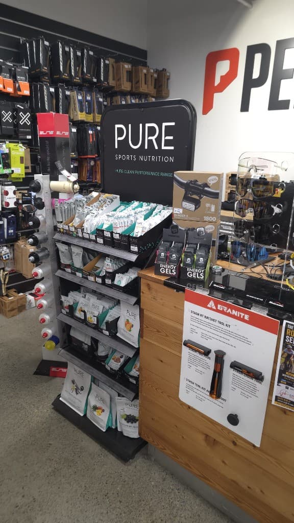 Pure sports nutrition stand and lights in the shop